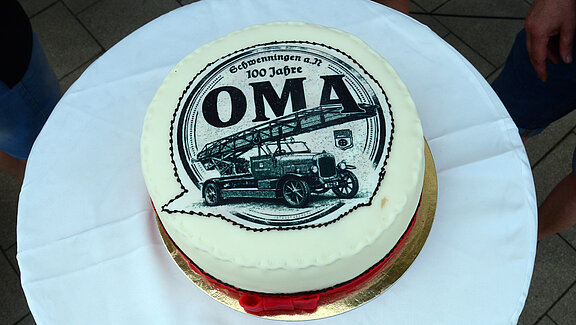 Runde Torte mit einem Deckel der historischen Drehleiter.